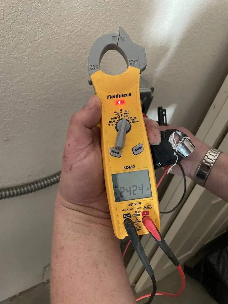 Voltage testing with clamp meter during Outlet Installation in Bellevue